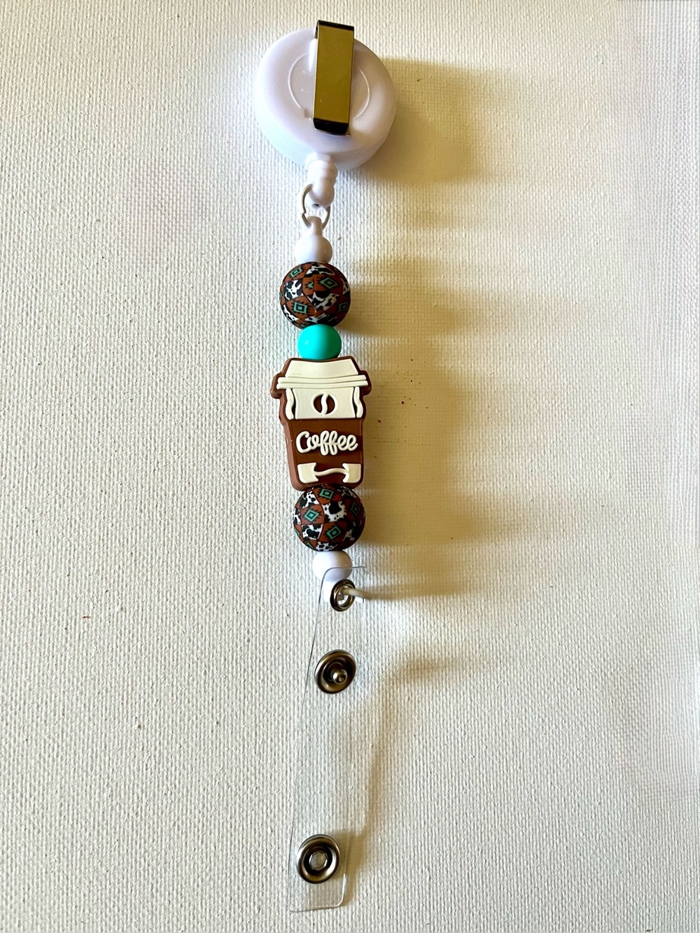 Coffee-Themed Badge Reel with Brown and Teal Beads